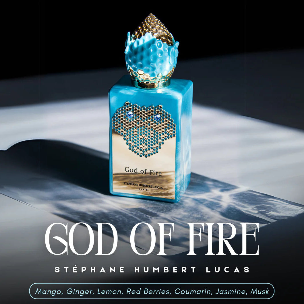 Perfume bottle labeled 'God of Fire' by Stéphane Humbert Lucas on a dark background